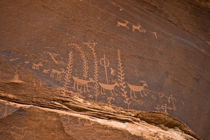 Hunters with atlatls, sheep, and flute player
