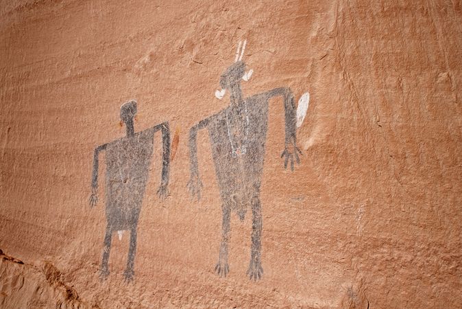 Hunters with atlatls, sheep, and flute player