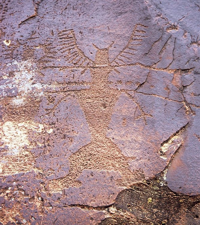 Fremont figure with a small waist, comb-like antlers and a kilt