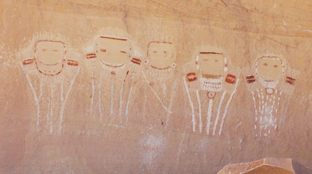 The Five Faces panel: five white faces with red and white details