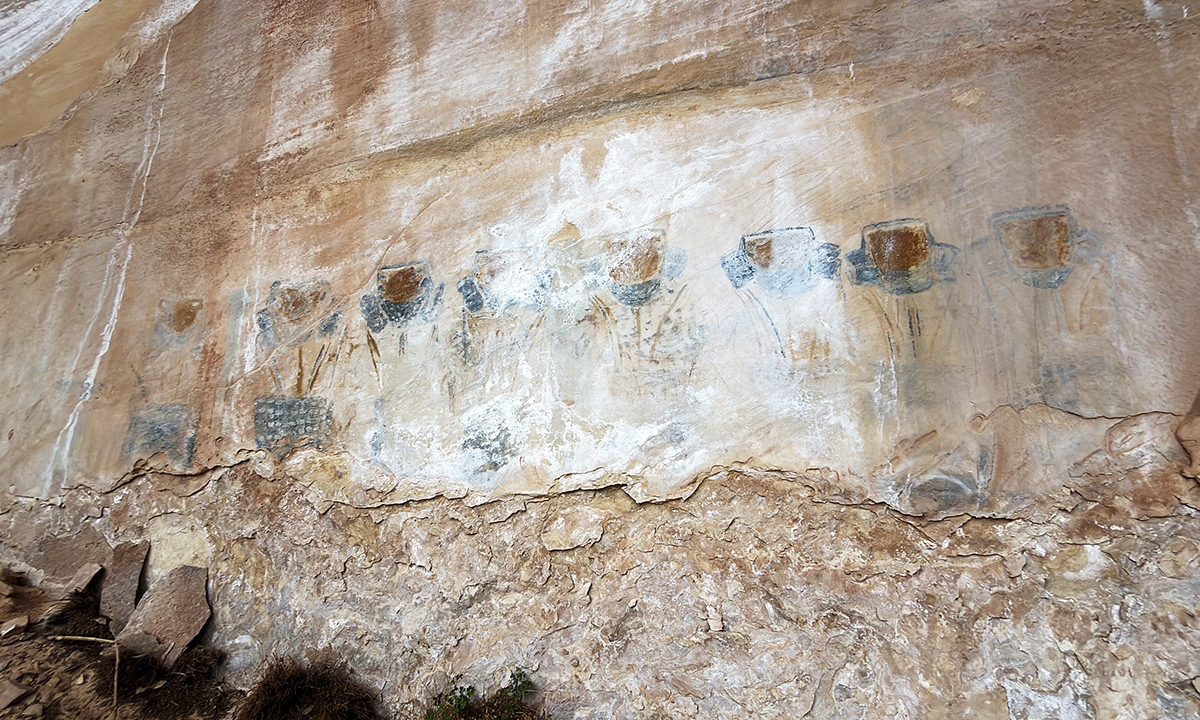 The Eleven Faces panel: a row of faded blue and white faces