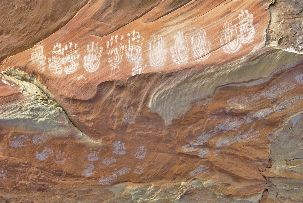 White handprints on the front and ceiling of a small alcove