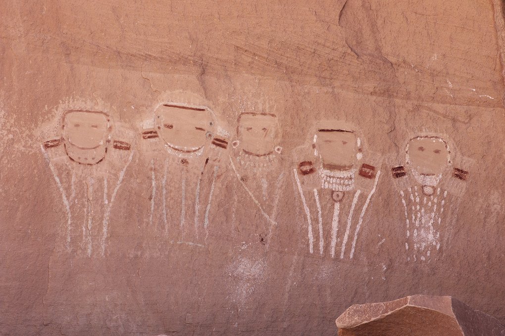 The Five Faces panel: five white faces with red and white details