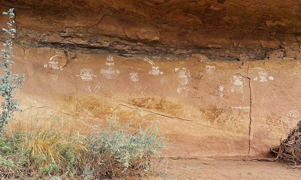 The Nine Faces panel: a row of small white faces along a cliff base