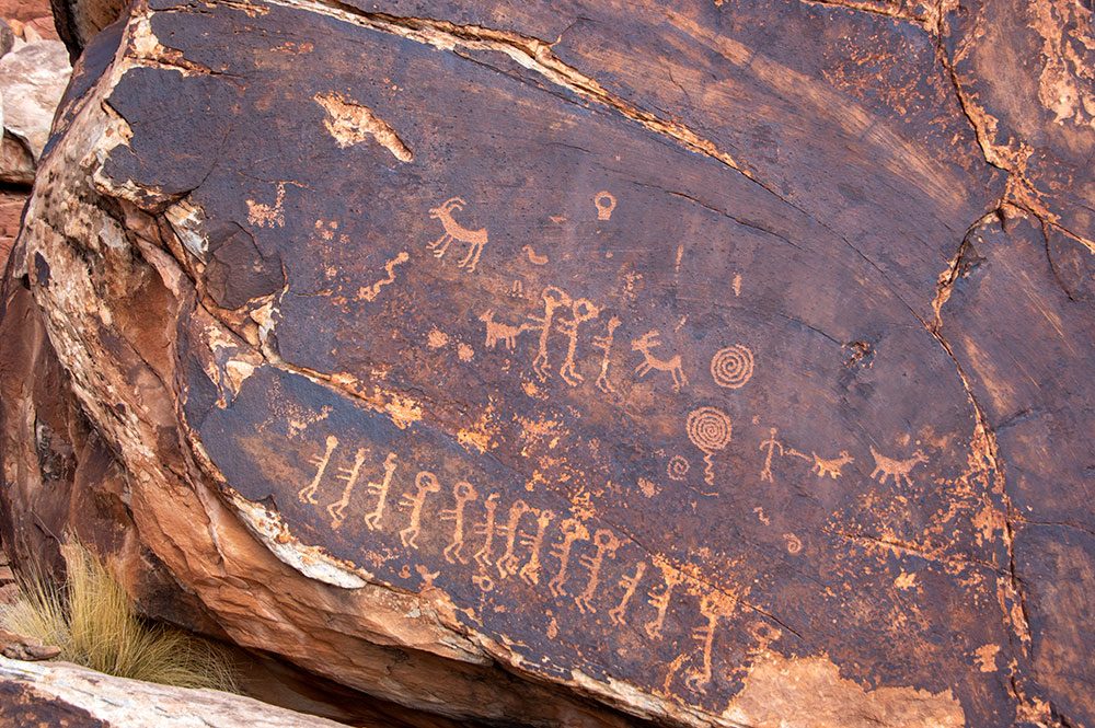 Petroglyph panel with twin figures, dancers, spirals and animals