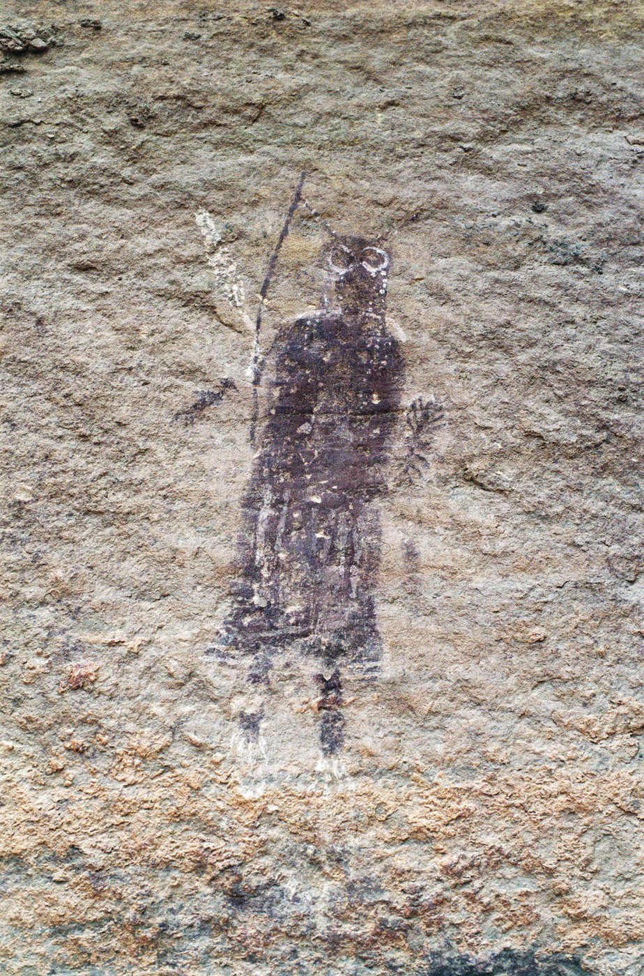 Part-human, part-animal painted figure near the Harvest Scene panel