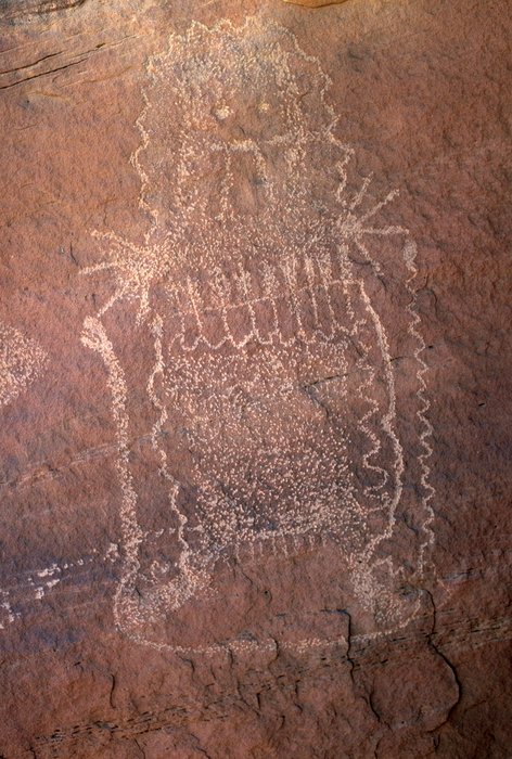 Interior Line Style figure with a dotted, patterned body and a snake curving around its lower edge